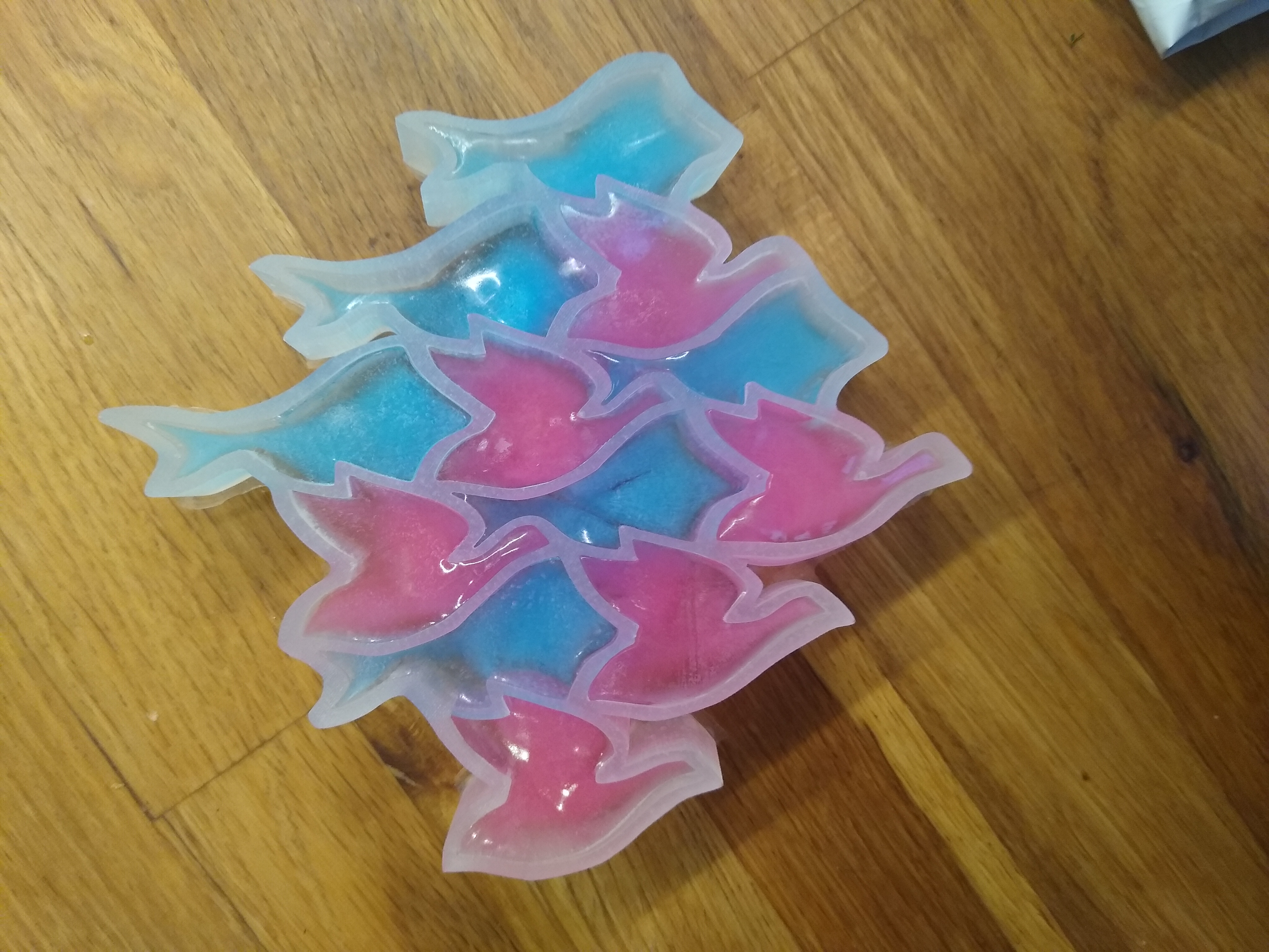 The mold filled with colored ice.